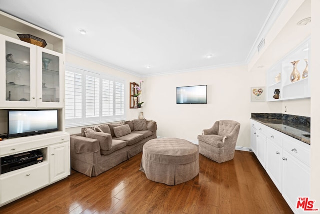 living room featuring crown molding and dark wood-type flooring