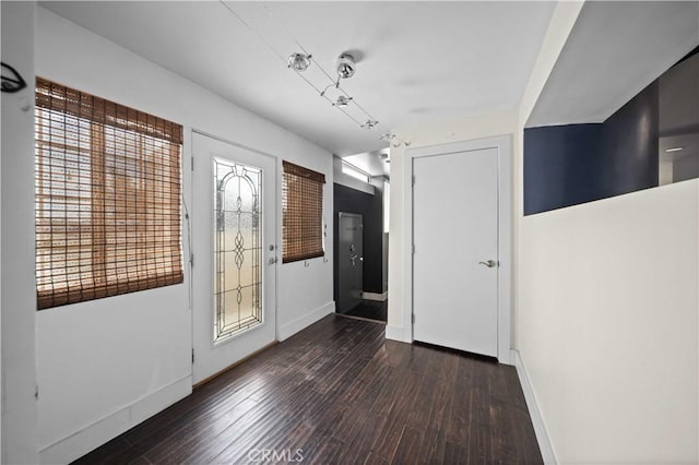 foyer entrance featuring dark hardwood / wood-style flooring