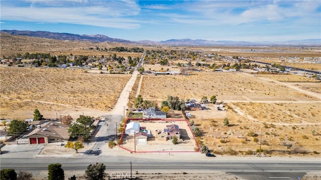 birds eye view of property featuring a mountain view