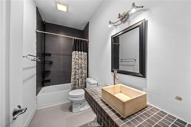 bathroom with tile patterned floors, shower / tub combo with curtain, and toilet