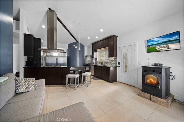 tiled living room featuring sink and lofted ceiling