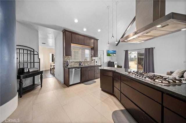 kitchen with backsplash, dark brown cabinetry, wall chimney exhaust hood, and stainless steel appliances