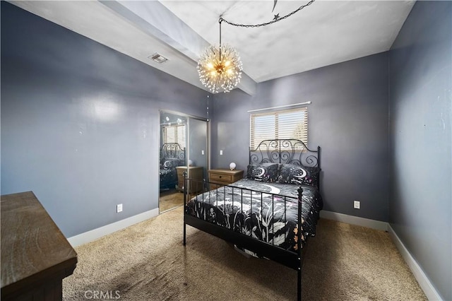 bedroom with carpet and a notable chandelier