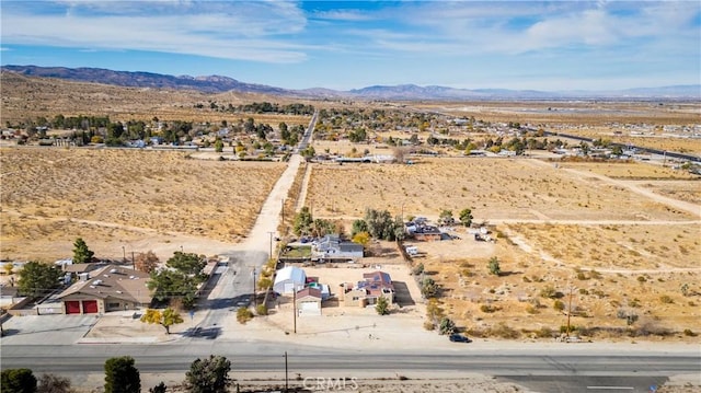 drone / aerial view featuring a mountain view