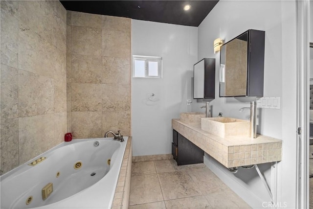 bathroom featuring tile patterned flooring and tiled tub