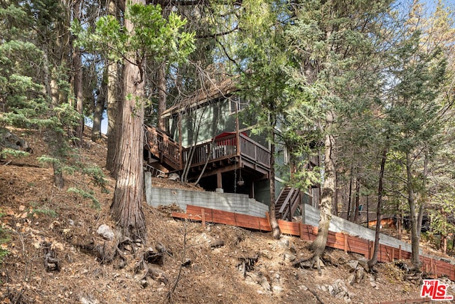 rear view of property with a deck