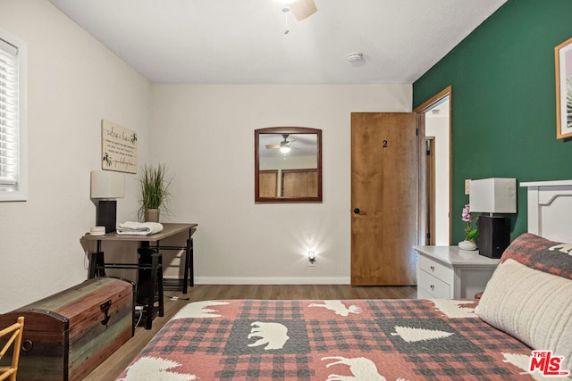 bedroom featuring hardwood / wood-style floors and ceiling fan