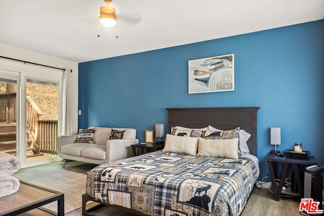 bedroom featuring access to outside, ceiling fan, and hardwood / wood-style floors