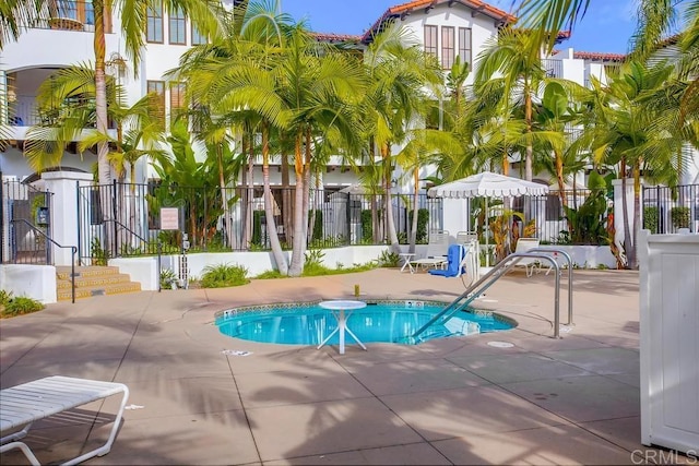 view of swimming pool featuring a patio area