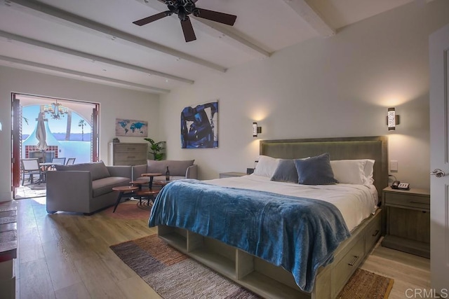 bedroom featuring ceiling fan, beam ceiling, and light wood-type flooring