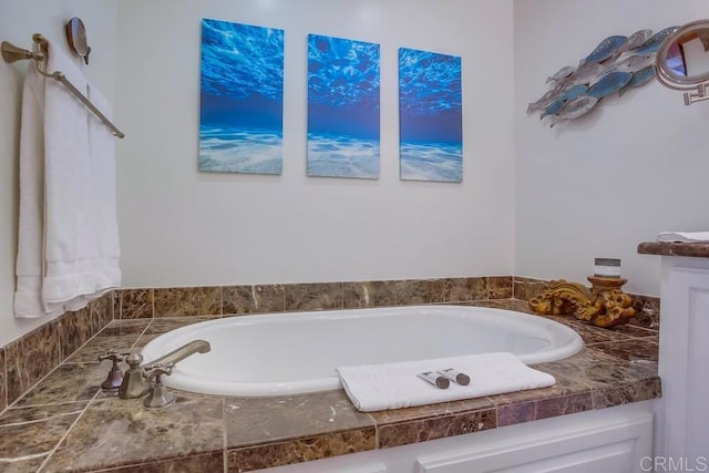 bathroom featuring tiled tub