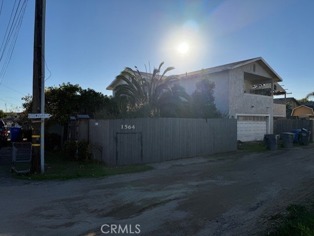 view of side of property featuring a garage