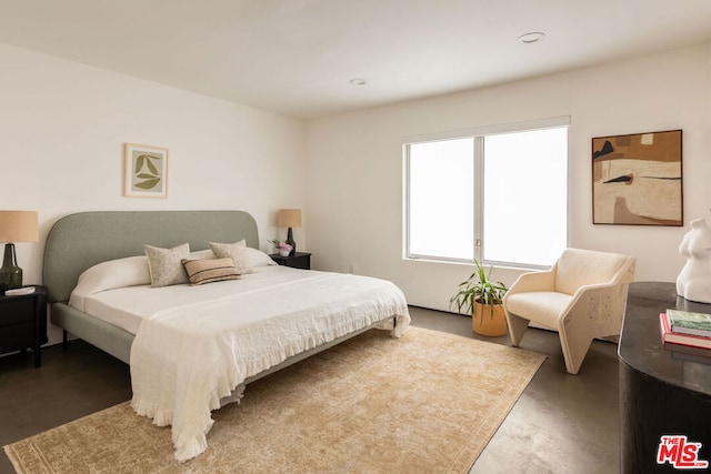 bedroom with concrete floors