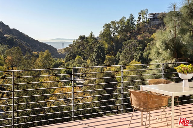 balcony featuring a mountain view