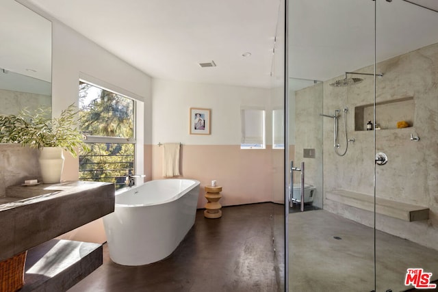 bathroom with concrete flooring, plus walk in shower, and a healthy amount of sunlight