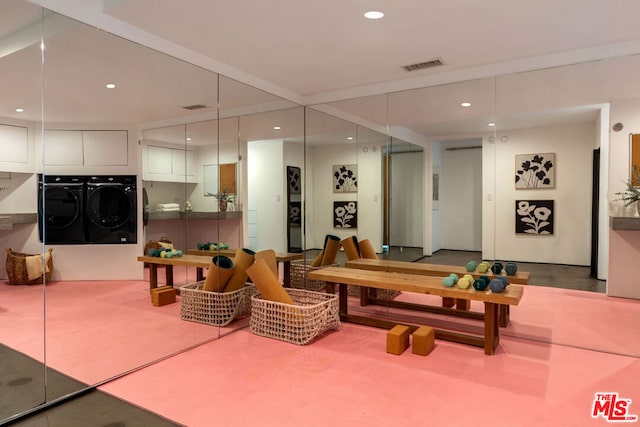 recreation room with washing machine and dryer