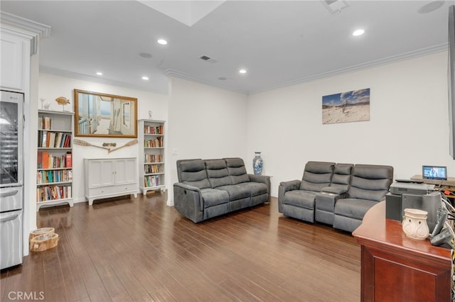 living room featuring hardwood / wood-style floors, wine cooler, and crown molding