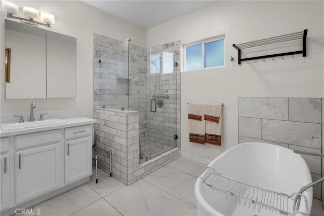 bathroom featuring vanity and shower with separate bathtub