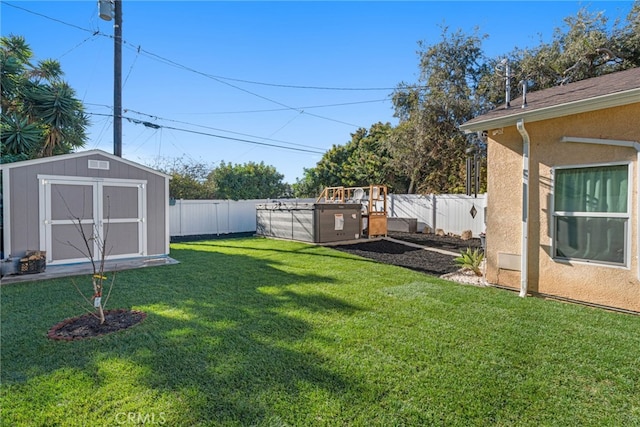 view of yard featuring a shed and a pool