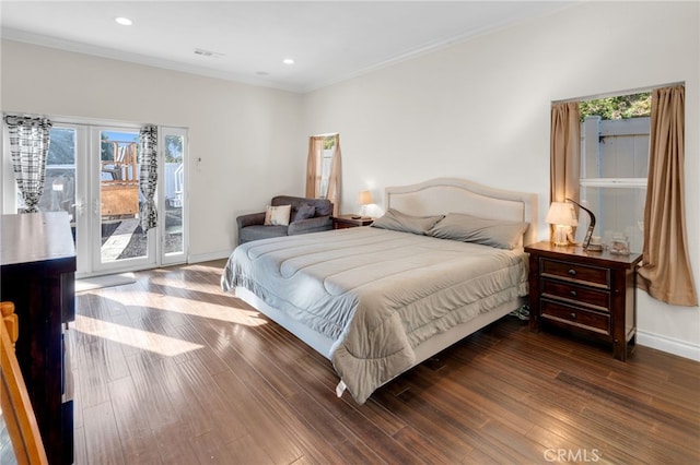 bedroom with hardwood / wood-style floors, access to outside, french doors, and crown molding