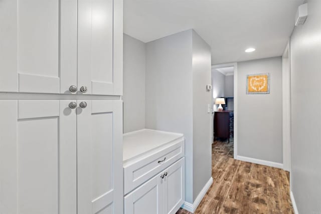 hall with light hardwood / wood-style floors