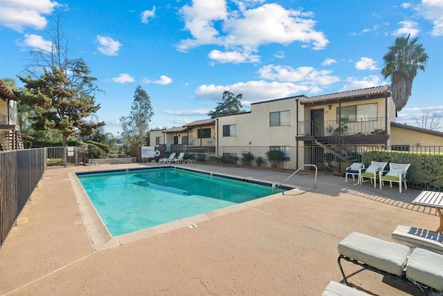 view of swimming pool featuring a patio area