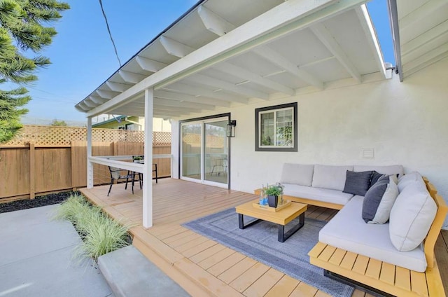 wooden terrace featuring outdoor lounge area