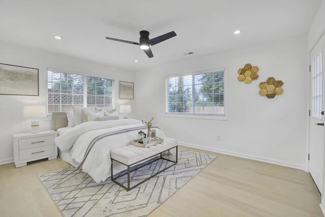 bedroom with ceiling fan and light hardwood / wood-style flooring