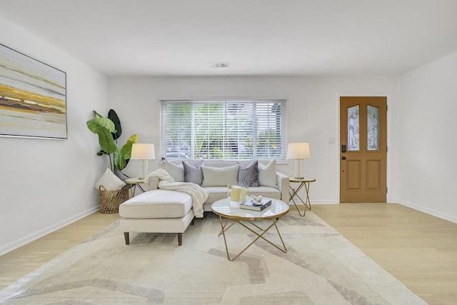 sitting room with light hardwood / wood-style flooring