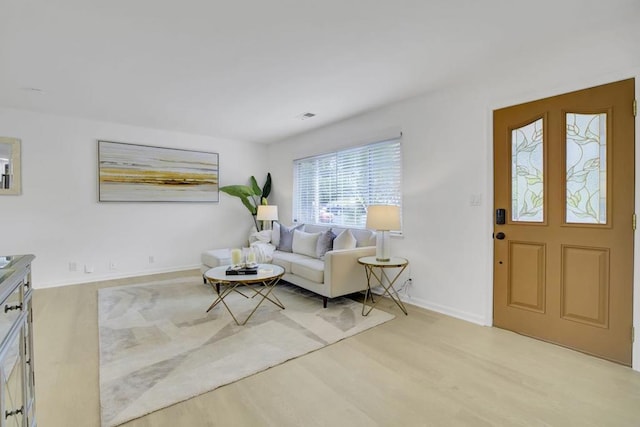 living room with light hardwood / wood-style flooring