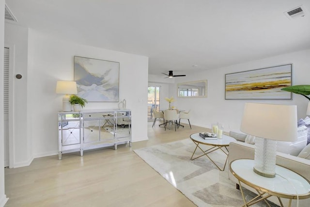 sitting room featuring ceiling fan and light hardwood / wood-style flooring