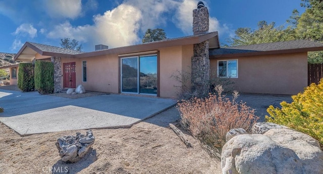 rear view of house with a patio