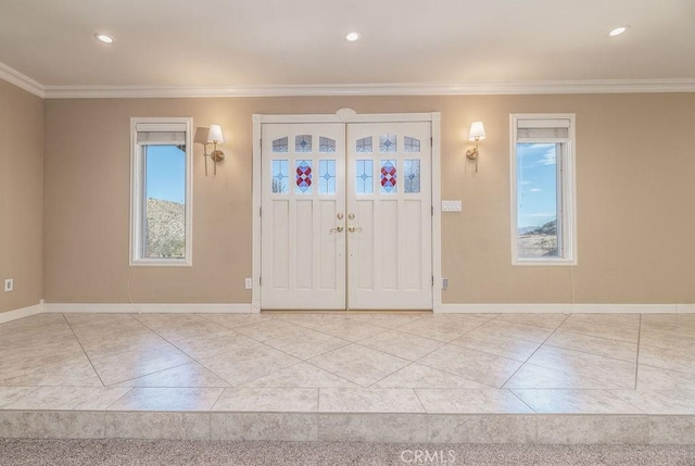 foyer entrance featuring ornamental molding