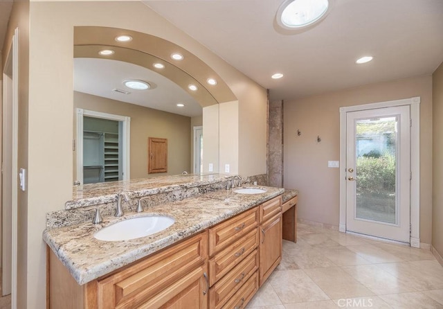 bathroom featuring tile patterned floors and vanity