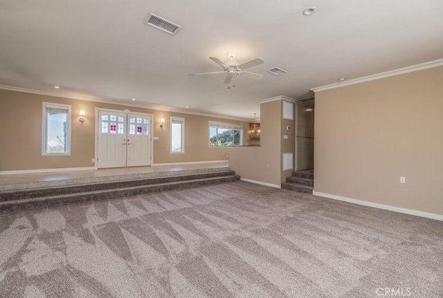 unfurnished living room with carpet flooring, ceiling fan, and ornamental molding