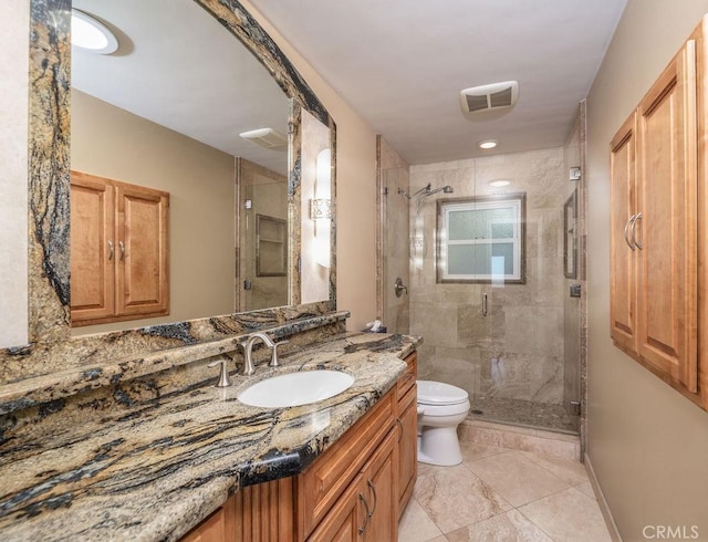 bathroom featuring vanity, toilet, and walk in shower