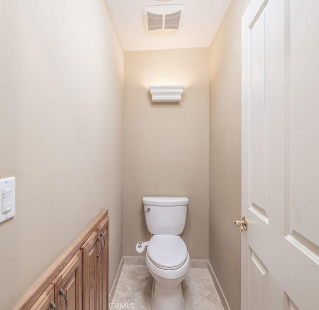 bathroom featuring tile patterned floors and toilet