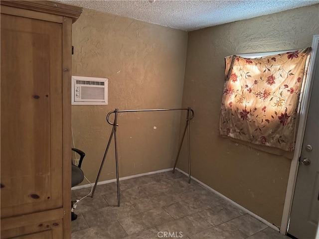 laundry area featuring a textured ceiling