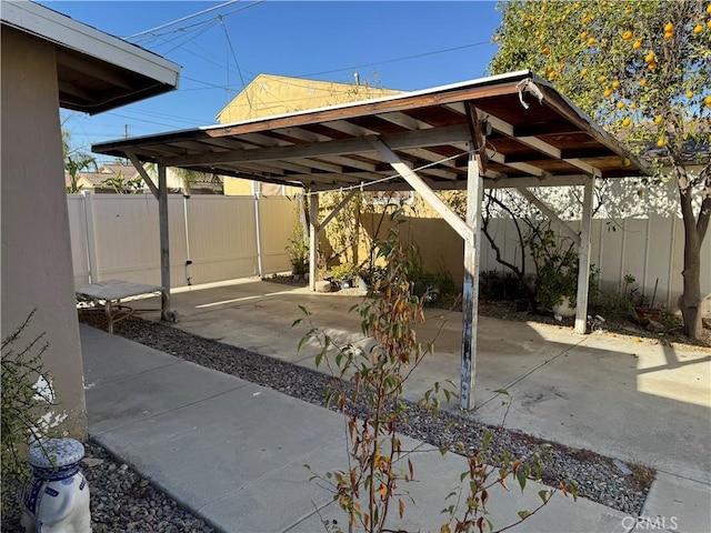 view of vehicle parking featuring a carport