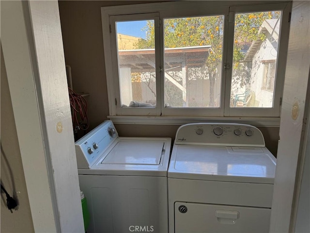 washroom with separate washer and dryer