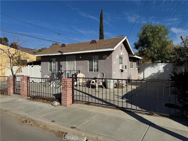 bungalow-style home with cooling unit