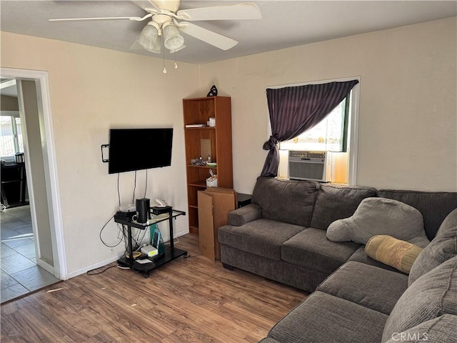 living room with wood-type flooring, ceiling fan, and cooling unit