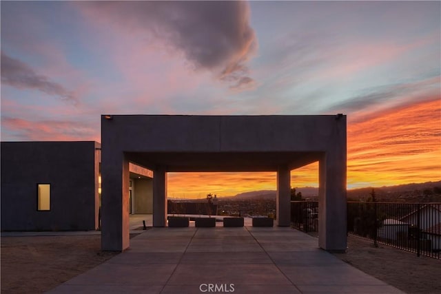 view of patio terrace at dusk