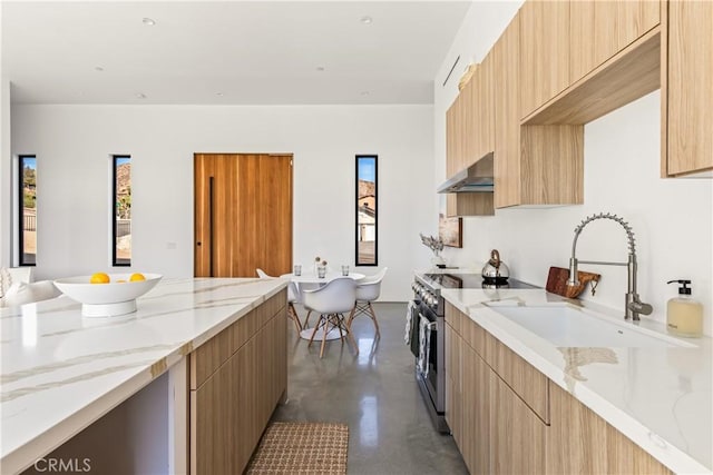 kitchen with light stone counters, ventilation hood, sink, light brown cabinets, and stainless steel electric range oven