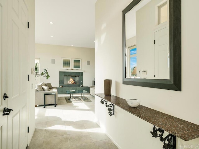 hall featuring recessed lighting and light tile patterned floors