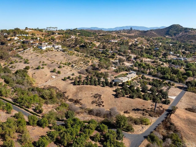 birds eye view of property with a mountain view