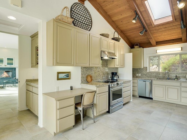 kitchen featuring tasteful backsplash, wood ceiling, cream cabinets, stainless steel appliances, and under cabinet range hood