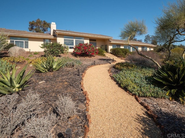 31340 Cottontail Ln, Bonsall, CA 92003 - view of front facade with stucco siding and a chimney