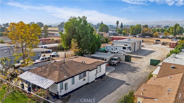 birds eye view of property featuring a mountain view