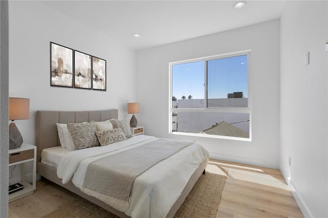 bedroom with light wood-type flooring